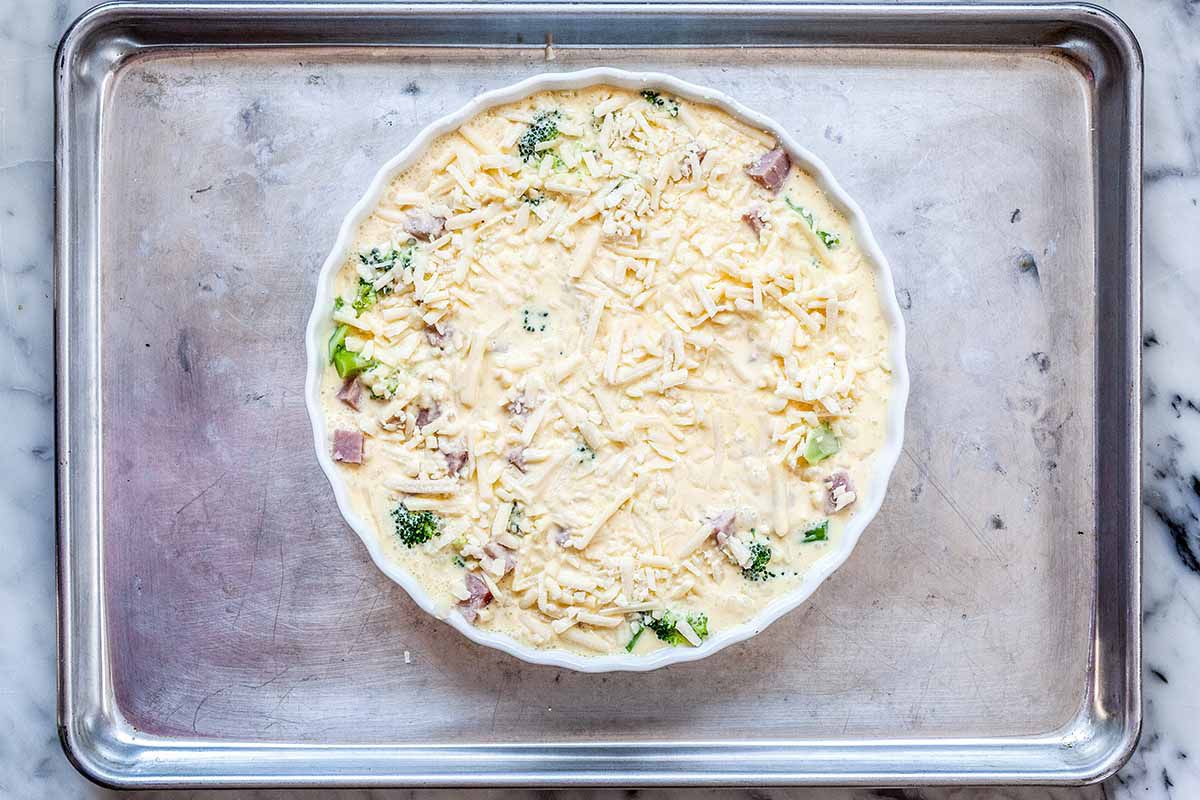 Easy Crustless Quiche - uncooked quiche in white dish