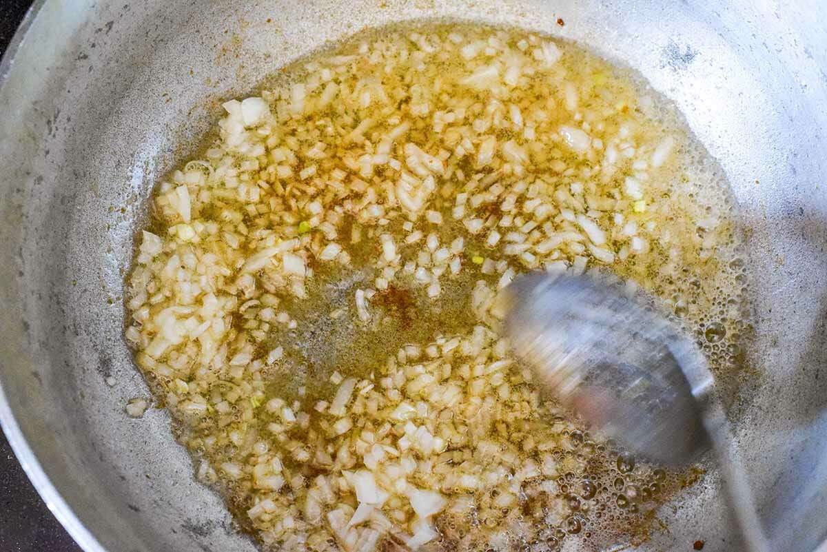 Puerto Rican Rice with Bacon cook the onions, garlic, recaito