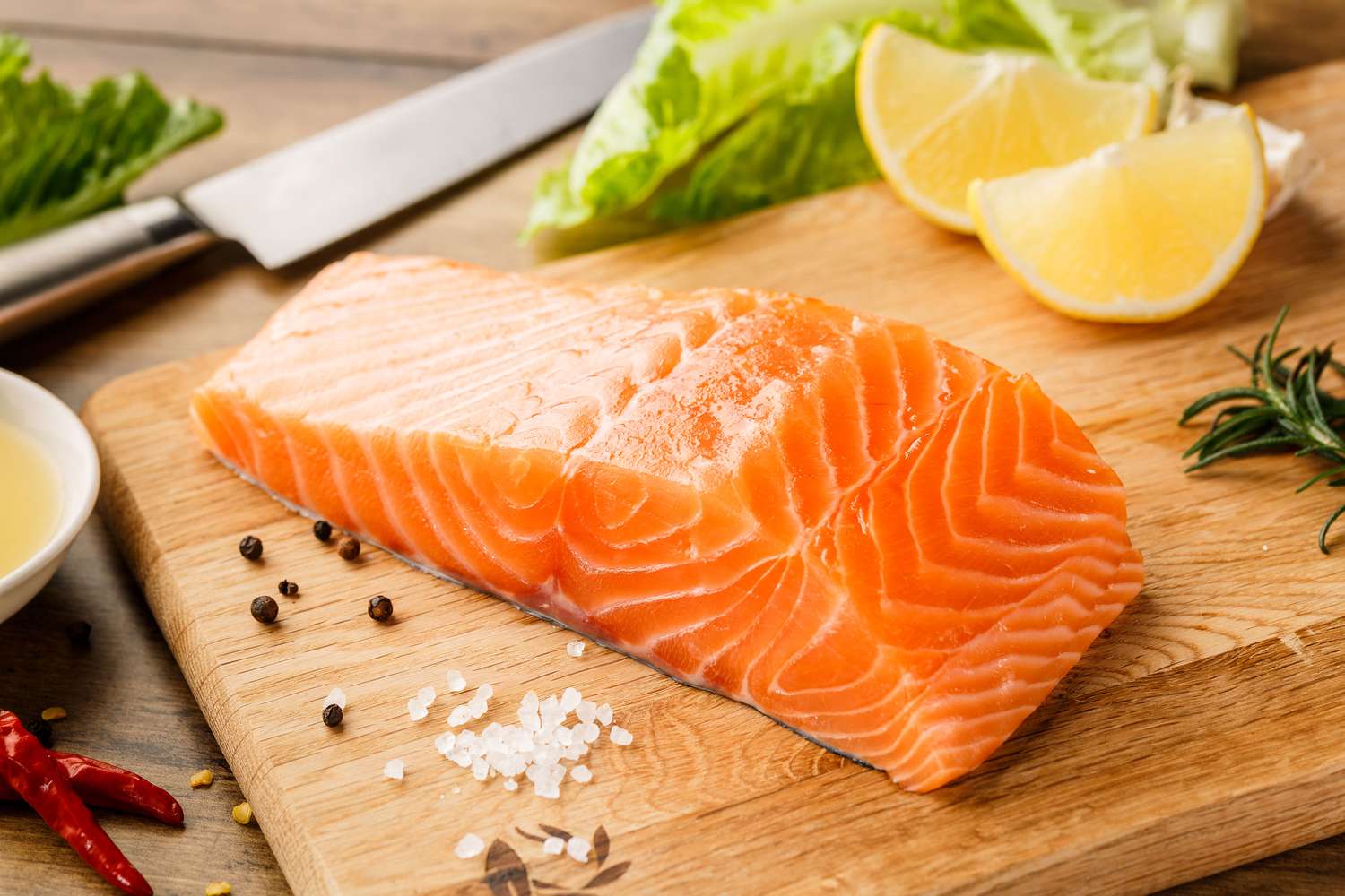 raw salmon fillet on a cutting board