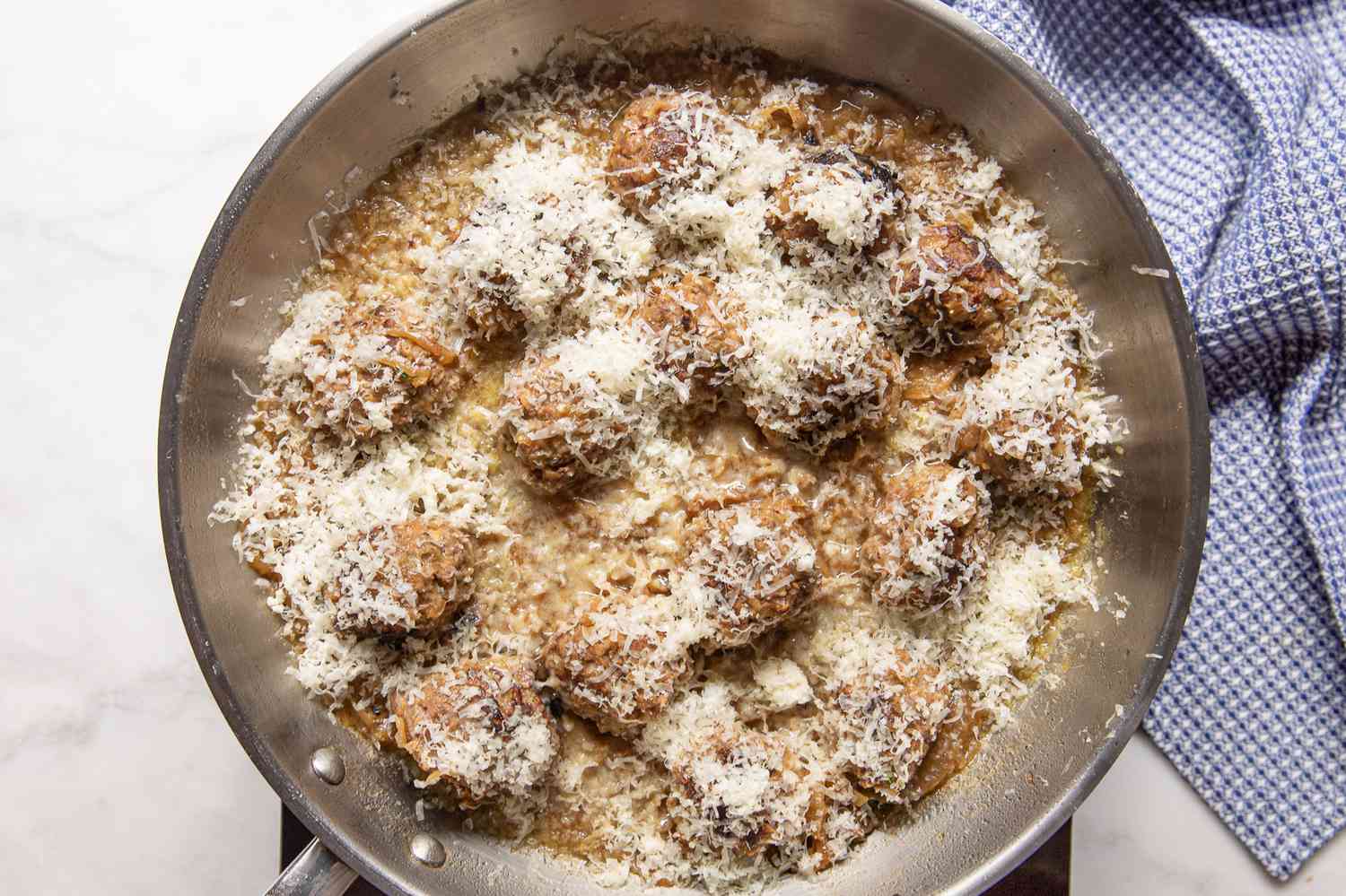 French Onion Meatballs Topped With Shredded Gruyere Cheese on the Portable Burner