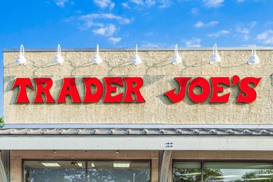 Trader Joe's store sign against a blue sky
