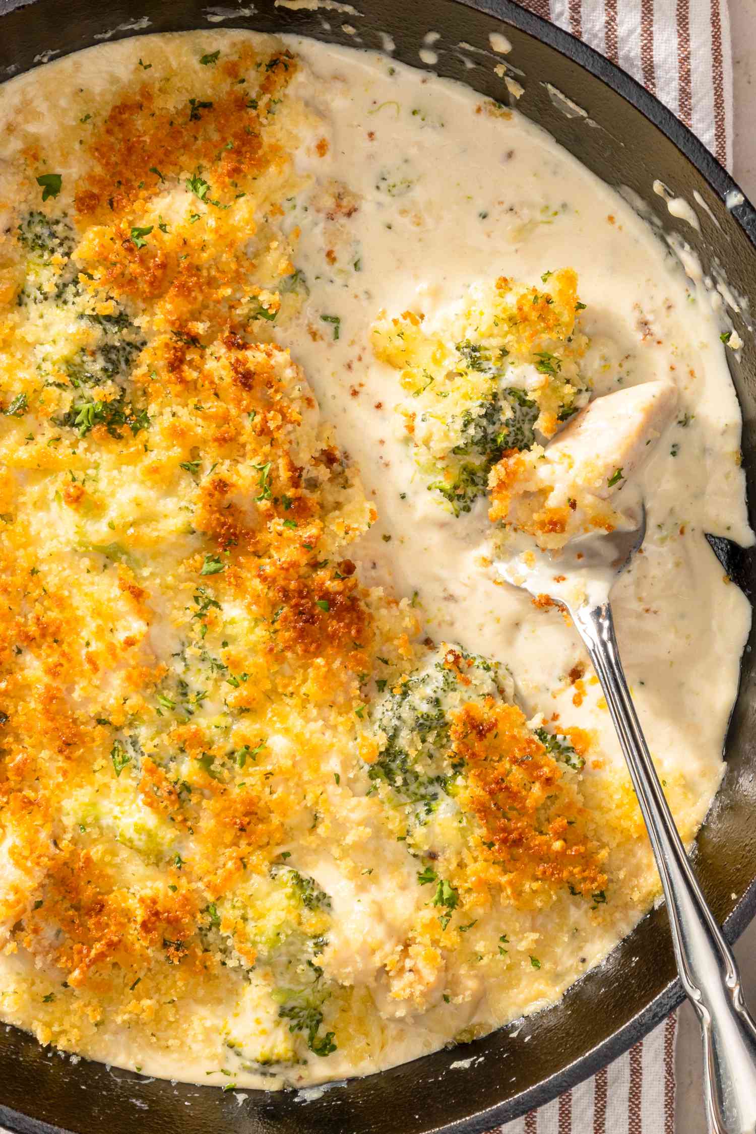 Cast iron skillet with chicken divan (some of the casserole already served)