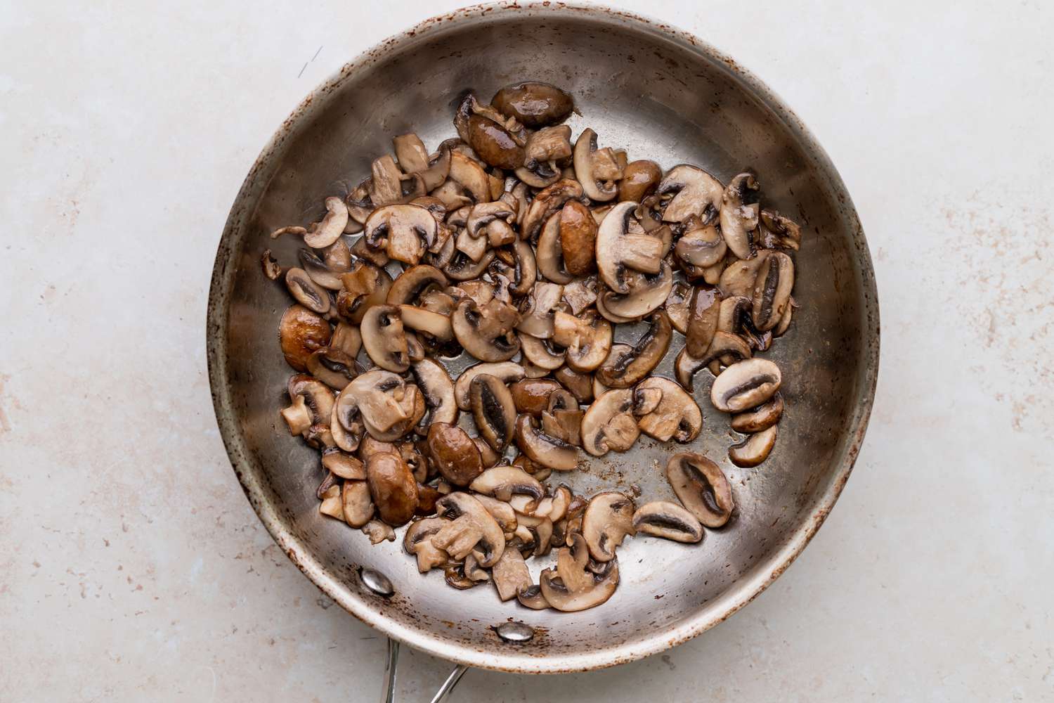 Sauteeing mushrooms to make a Turkey Tetrazzini Recipe.