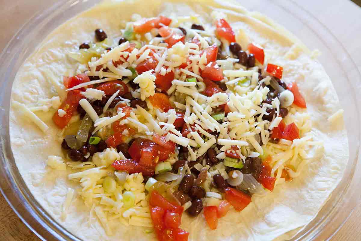 add cheese over filling for quesadilla pie