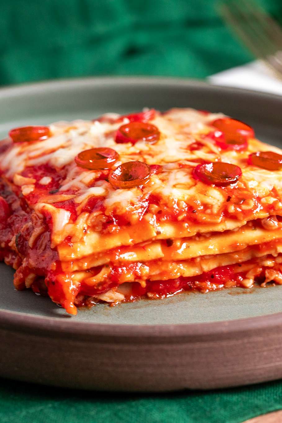 Slice of Pepperoni Pizza Lasagna on a Plate 