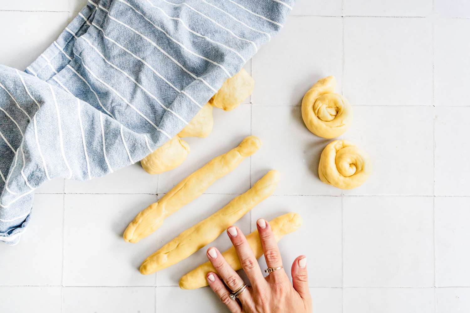 Dough Pieces Rolled into 12 Inch Ropes and Coiling Them to Make Rolls