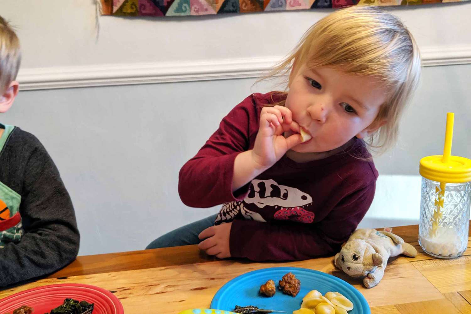 Kids try pasta with kale and sausage