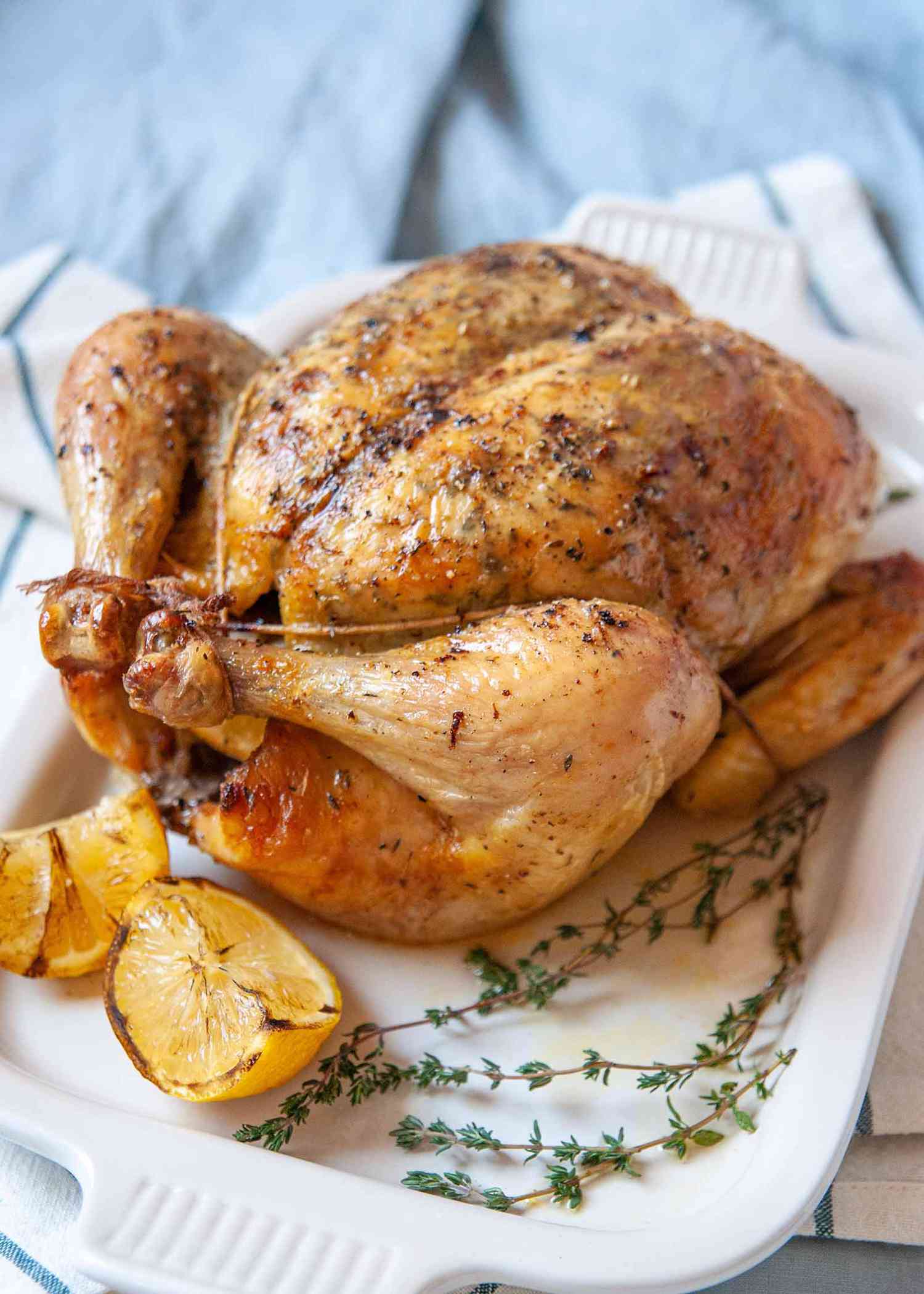 Brined Roast Chicken Recipe - - whole chicken on platter