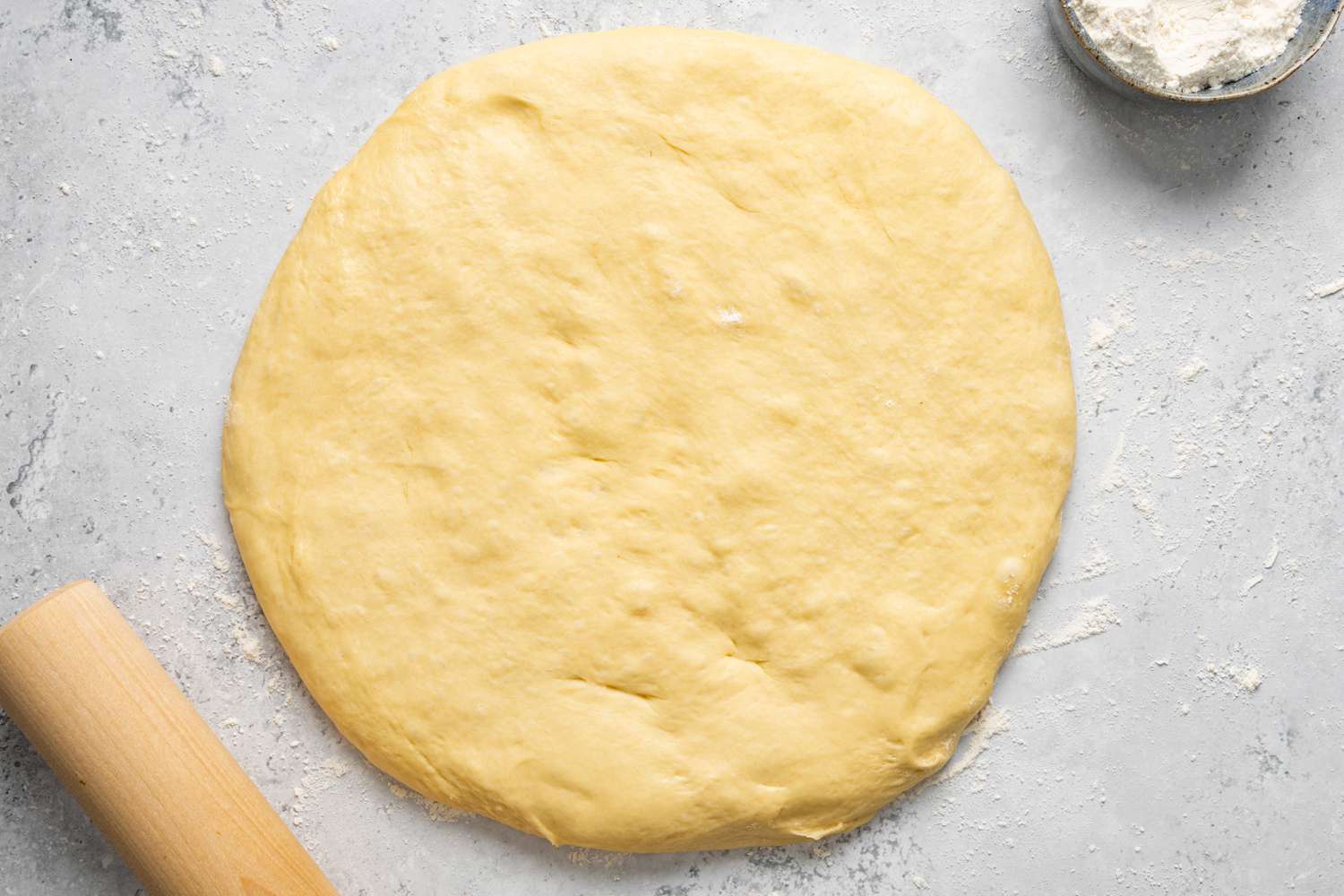 Donut Dough Rolled Out on a Floured Counter