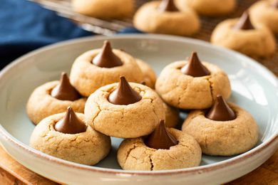 Peanut butter blossoms in a wide ceramic bowl.