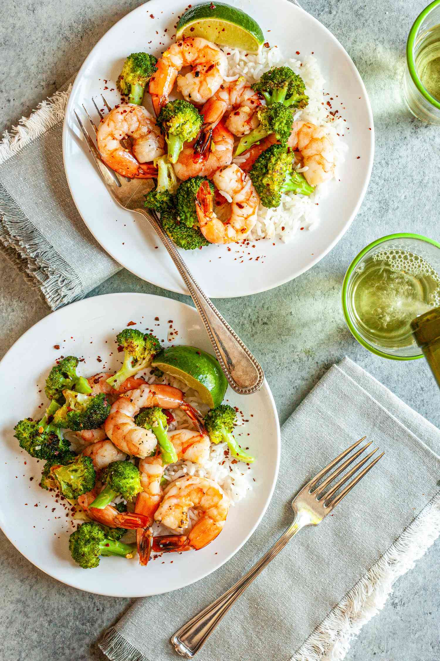 Sheet Pan Hot Honey Roasted Shrimp and Broccoli on two white plates.