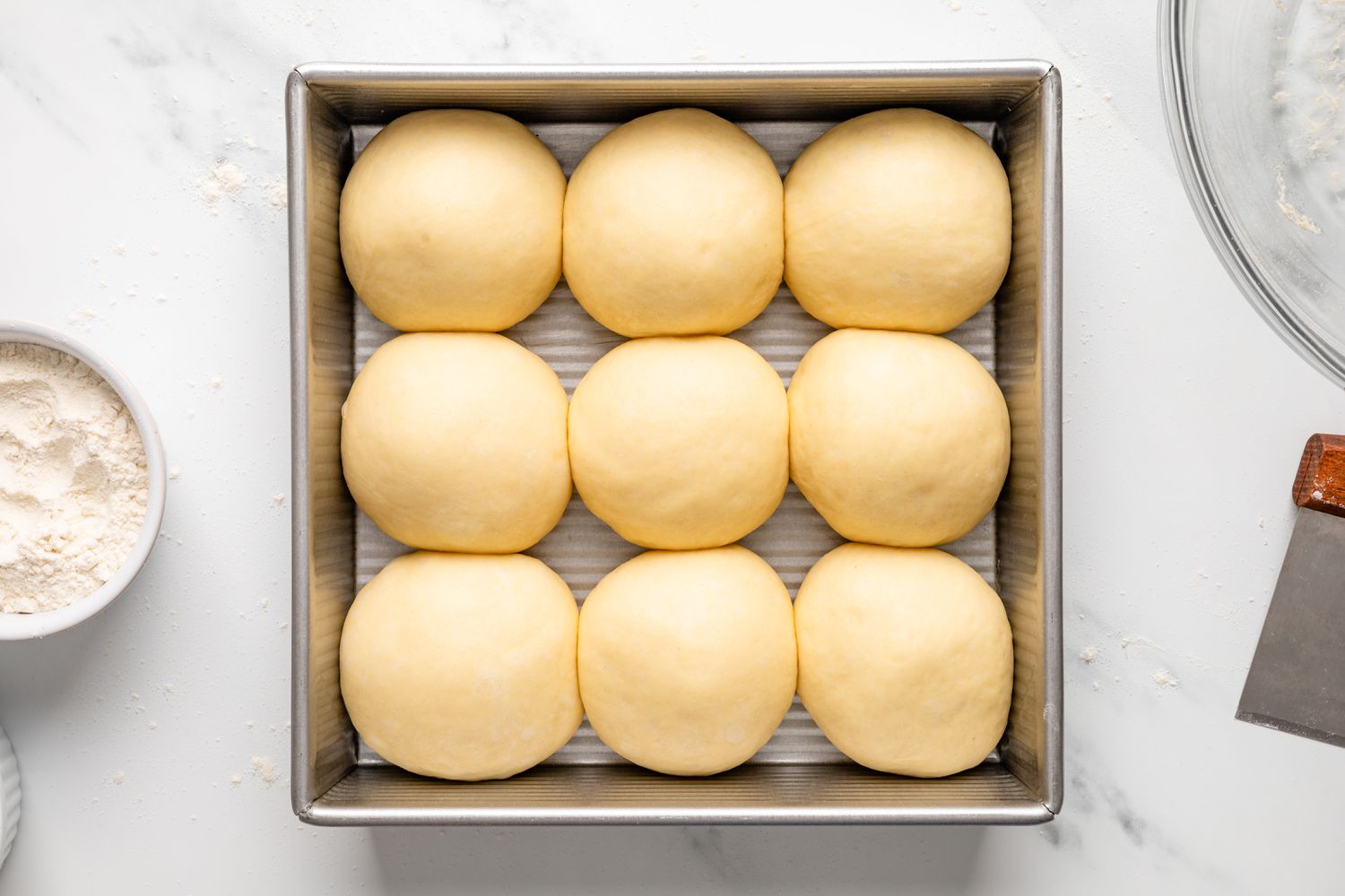 Dinner roll dough after second rise in the cake pan