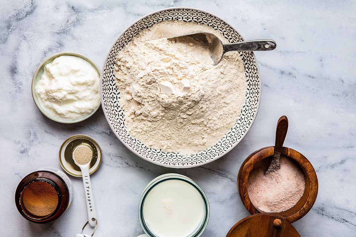 Naan Recipe - flour, oil, salt and milk in bowls