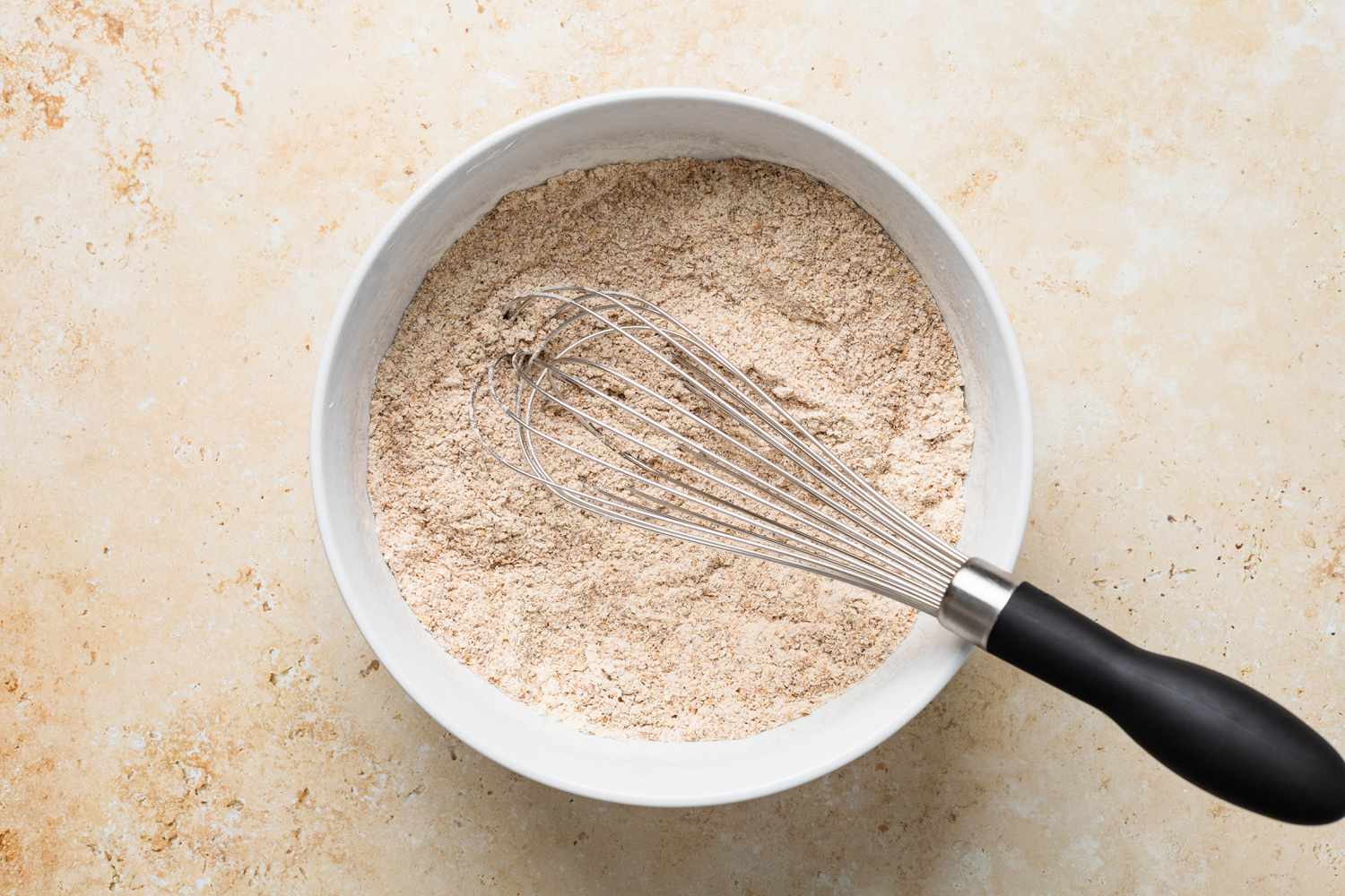 Dry ingredients whisked together for bran muffins recipe