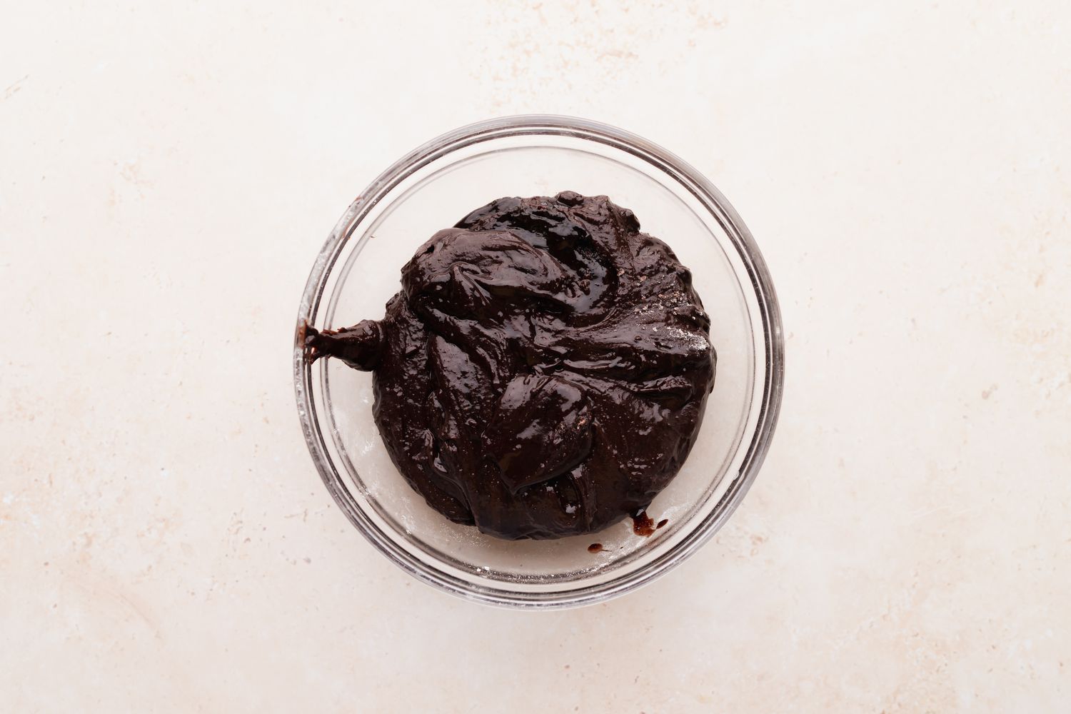 A bowl with dough to make chocolate christmas cookies.