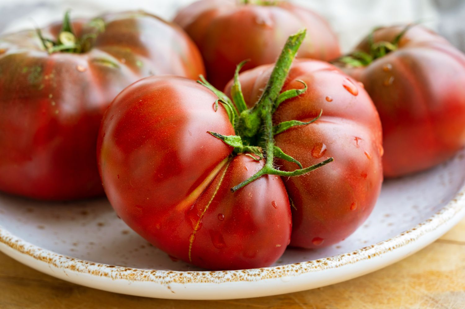 ripe heirloom tomatoes on a plate
