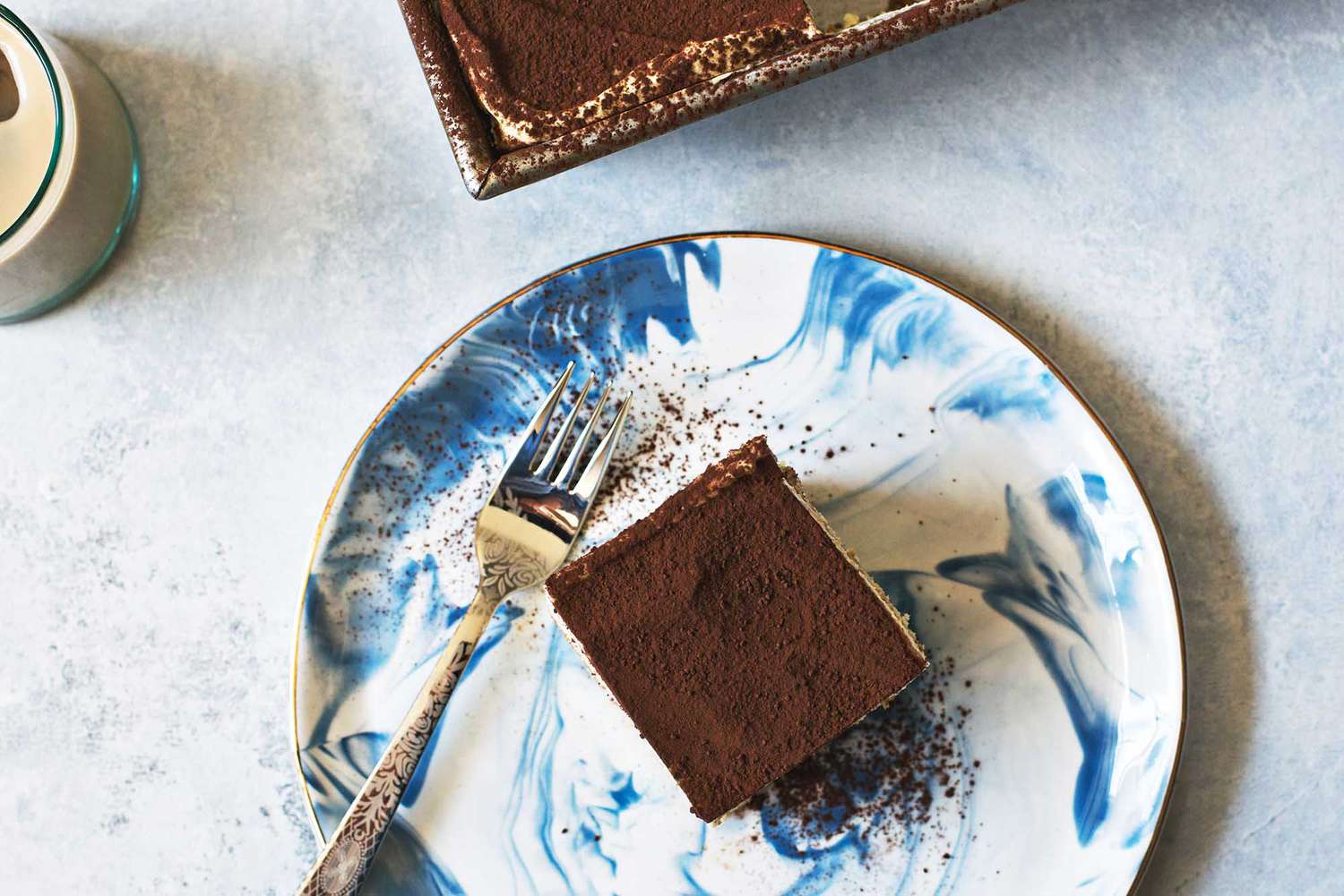 Overhead view of a piece of tiramisu on a plate