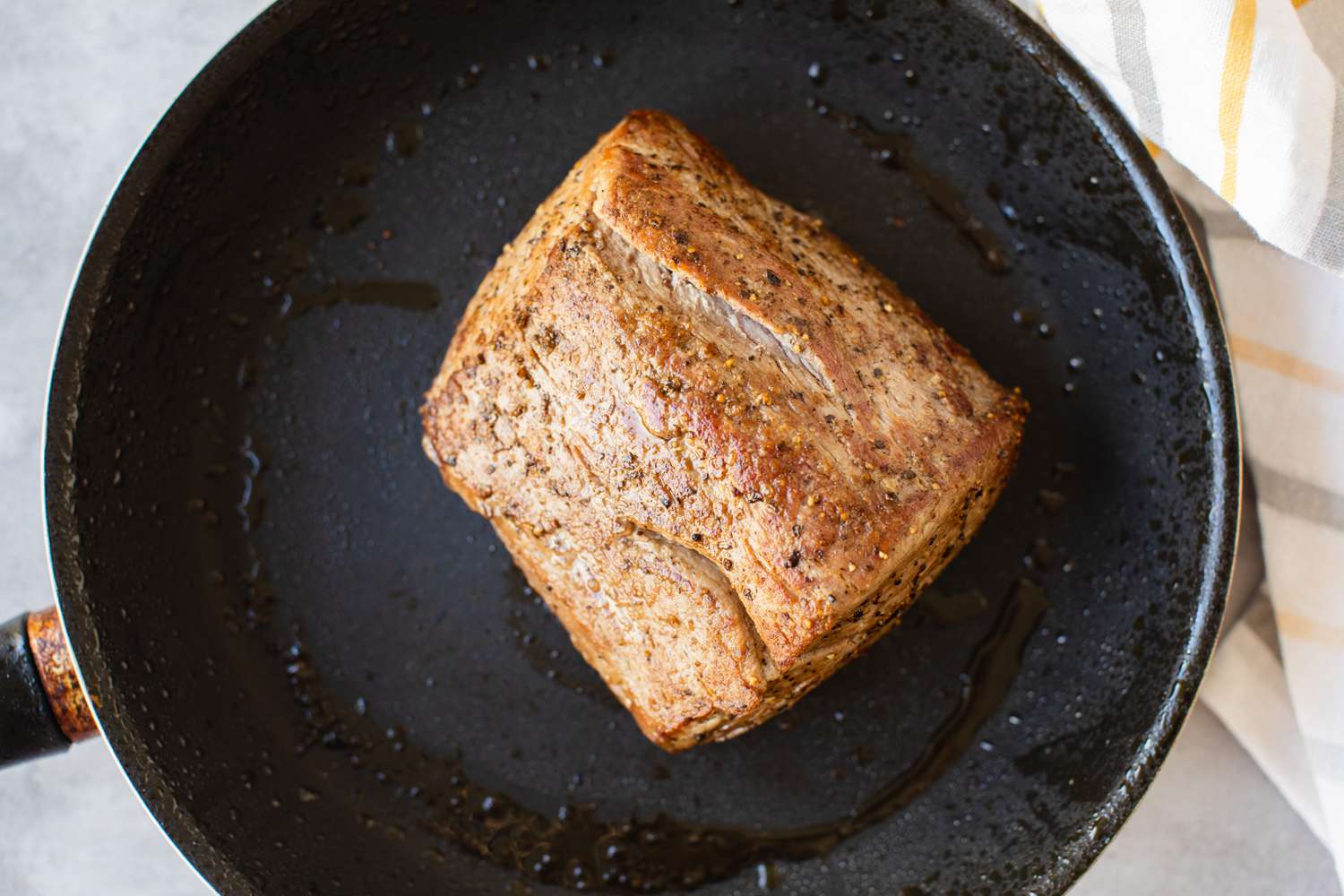 Beef Tenderloin Filet Seared on a Skillet for Beef Wellington Recipe