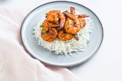 Peppery Garlic Shrimp Over Rice on a Plate
