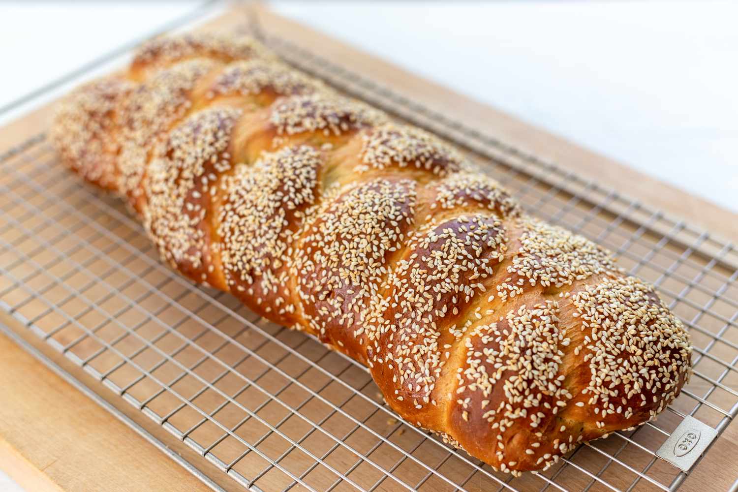 baked challah on wire rack