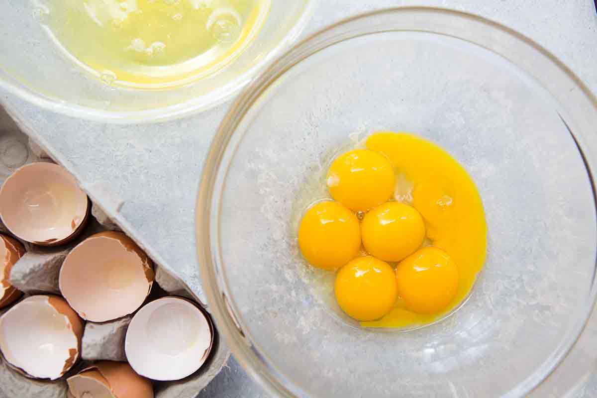 Egg whites and yolks in separate bowls 