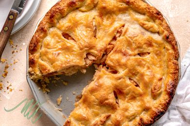 Photo of apple pie in an pie dish with a small illustration in the corner of the photo