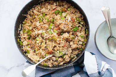 Overhead view of dirty rice in a skillet.