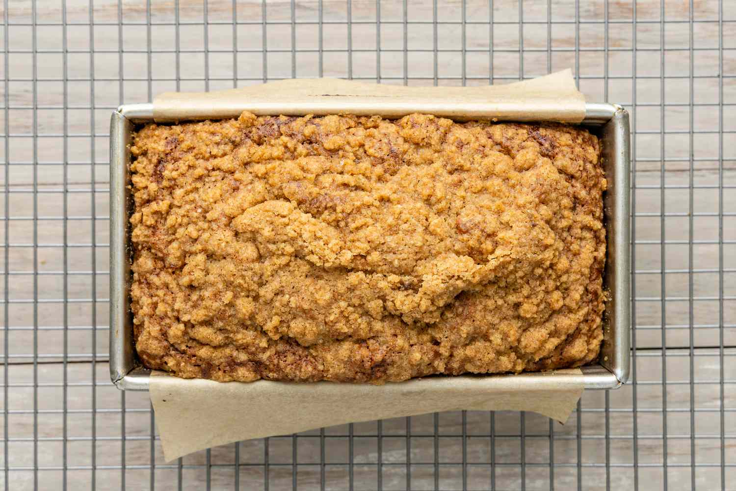 Baked Spiced Dulce de Leche Banana Bread in a Bread Pan on a Cooling Rack