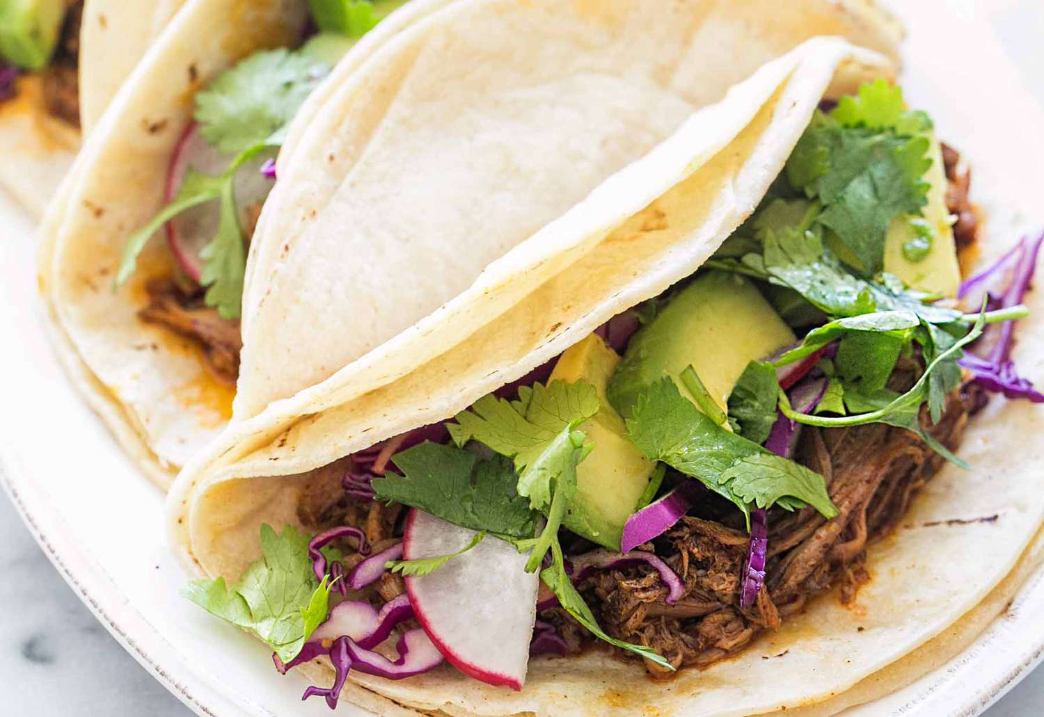 Slow Cooker Mexican Pulled Pork Tacos on a platter