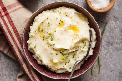 Make Ahead Mashed Potatoes Slow Cooker potatoes in a dish with butter and a napkin