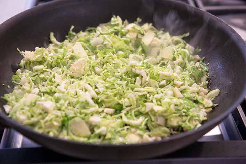 sautéing shaved brussels sprouts in a skillet