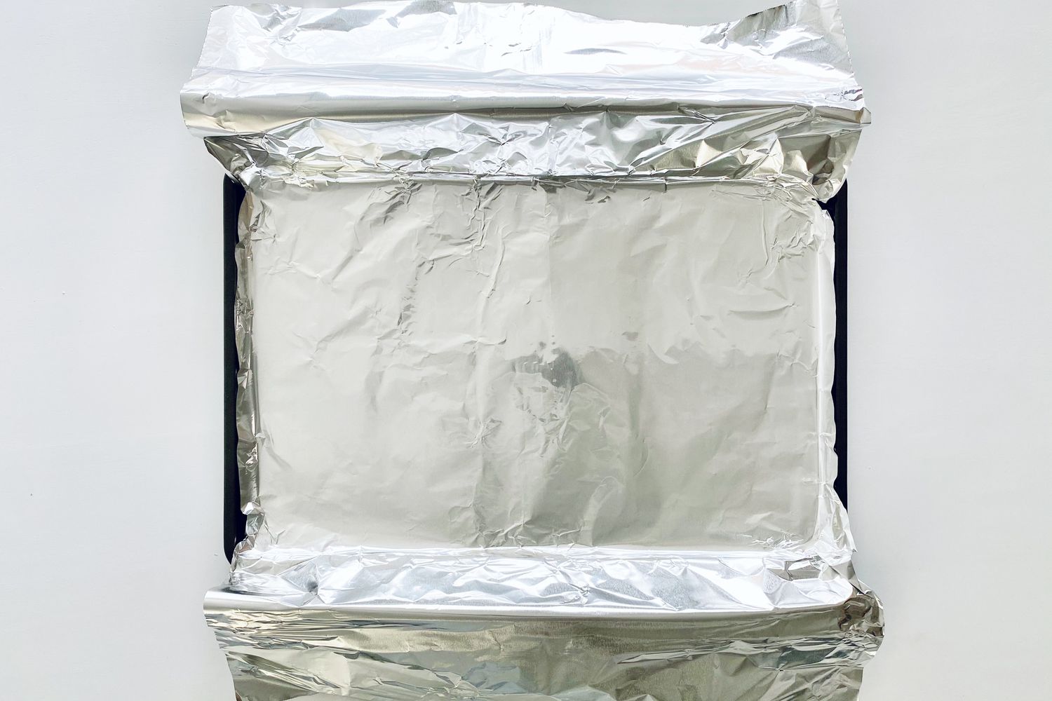 Foil lined baking sheet to make Garlic Butter Baked Salmon.