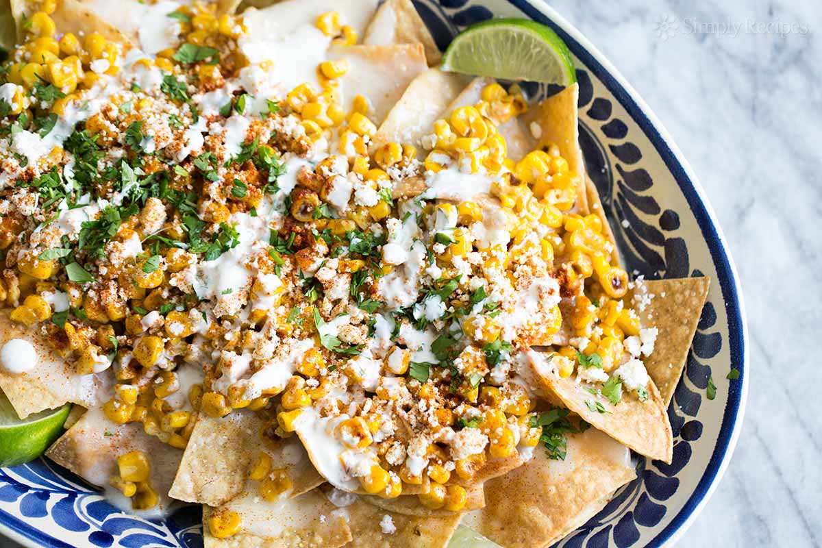 Mexican Street Corn Nachos on a plate with blue decor