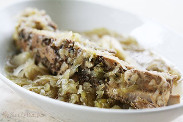 A braised spare rib over a bowl of sauerkraut