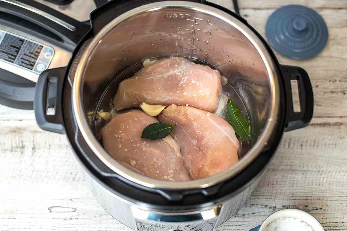 Add the garlic and bay leaves for the instant pot chicken