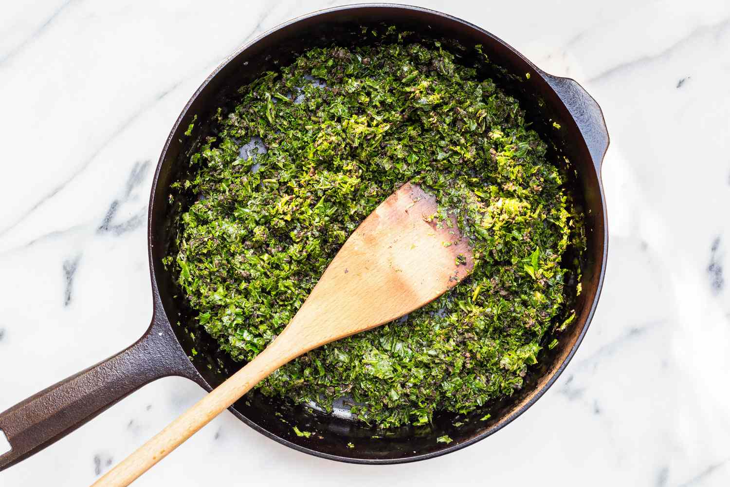 Cooked Kale in a Cast Iron Skillet for Kale and Mushroom Egg Bites Recipe