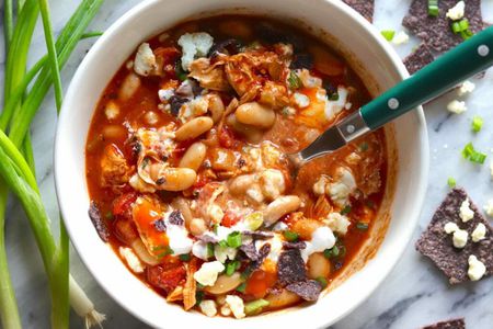 Bowl of buffalo chicken chili with toppings