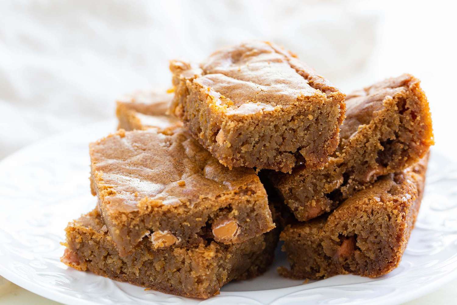 Homemade blondie bars on a plate