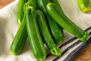 raw zucchini on a kitchen towel