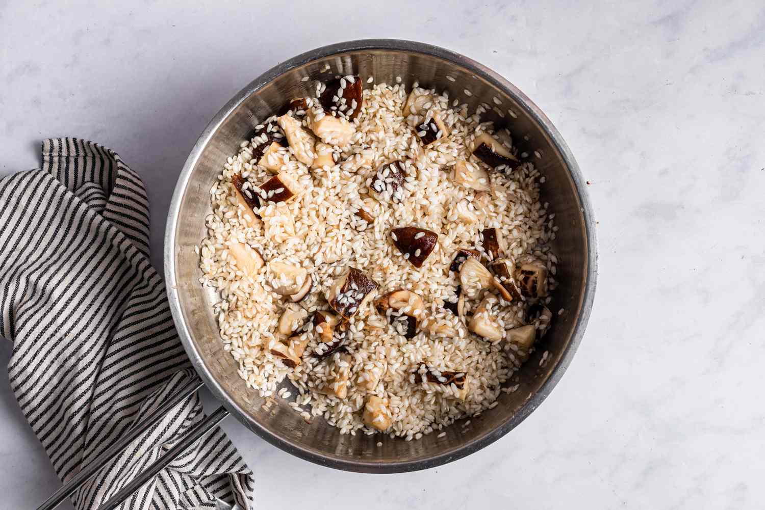 Risotto rice and mushrooms in a pot 