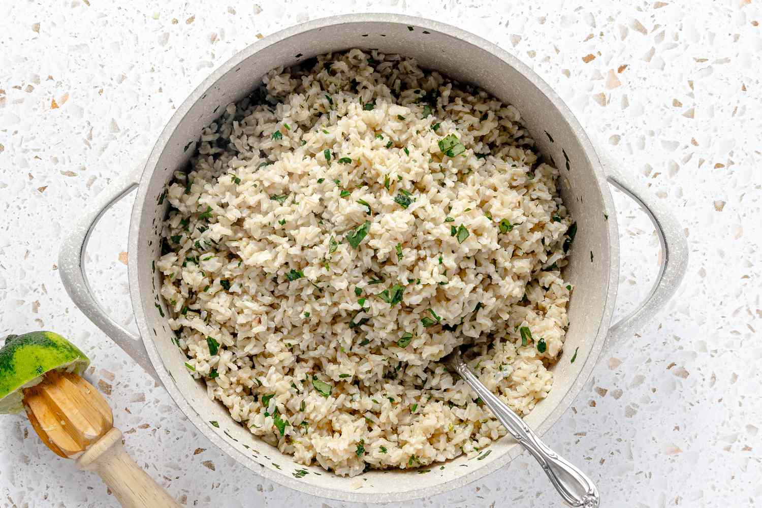 Cilantro, Lime Zest, and Lime Juice Added To Fluffed Rice for Freezer Burritos Recipe