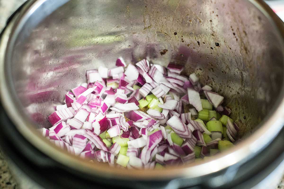 Cook the onions and celery for Instant Pot Beef Stew