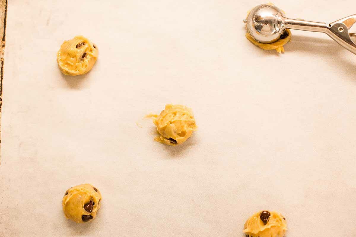 Flat Crispy Chocolate Chip Cookies scoop out the dough