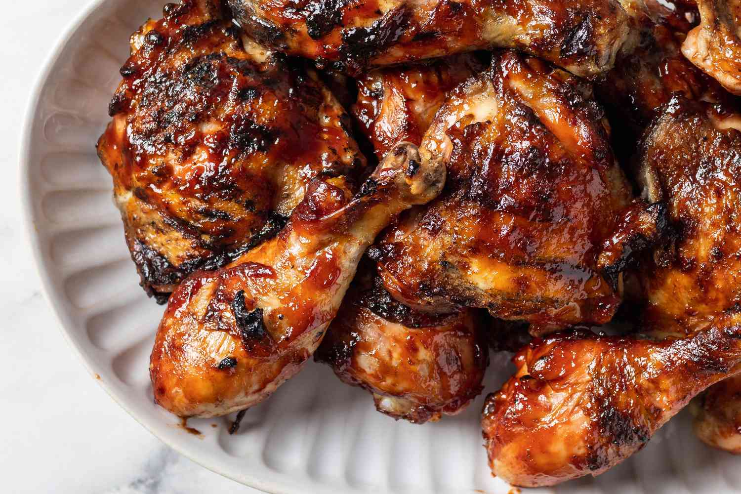 bbq chicken on a white plate