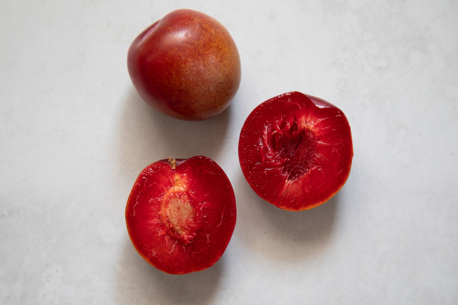 Opened plum showing pit