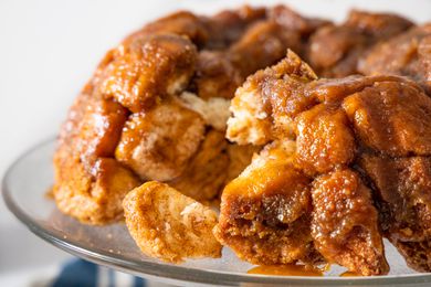 Monkey Bread on a Cake Stand with Pieces of Bread Broken Off 