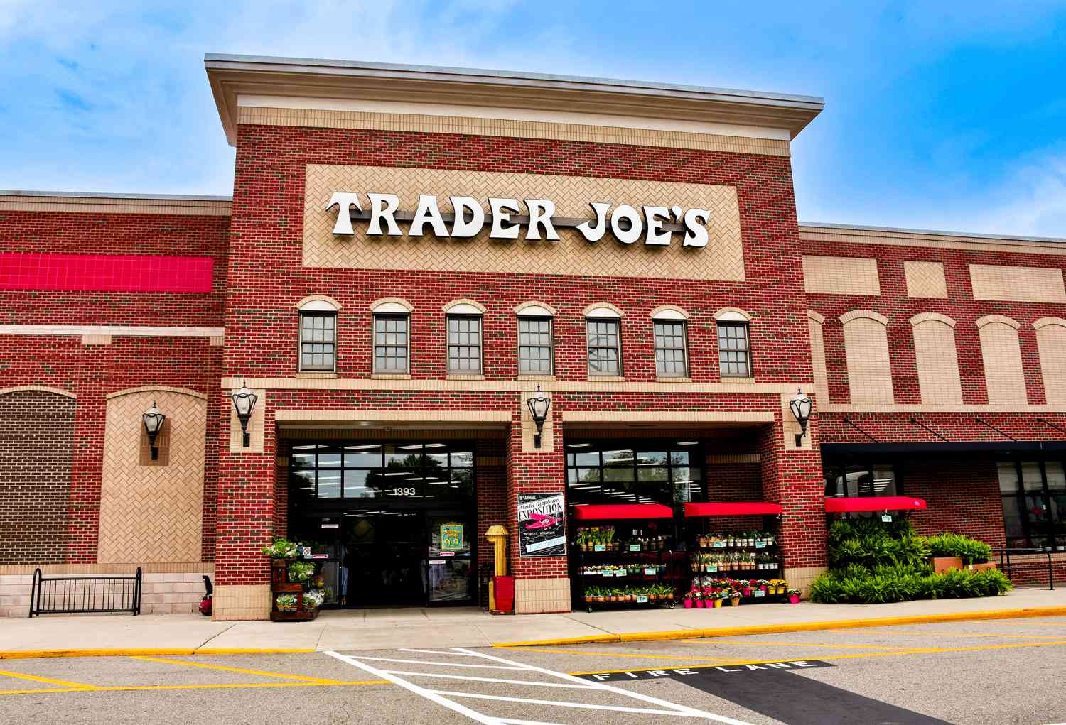 Ground level view of a Trader Joe's store front and sign