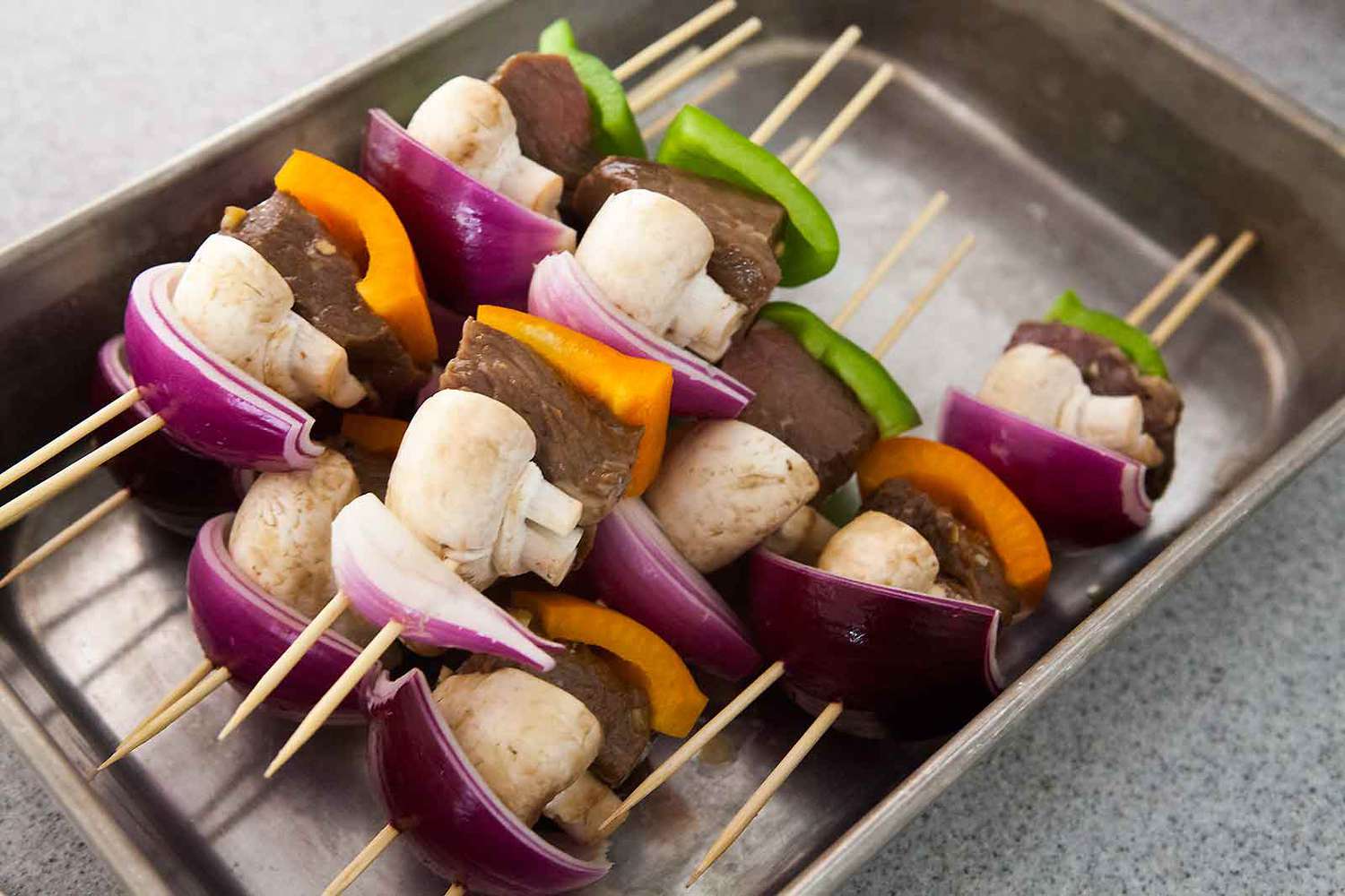 Beef Kabobs on a pan ready to be grilled