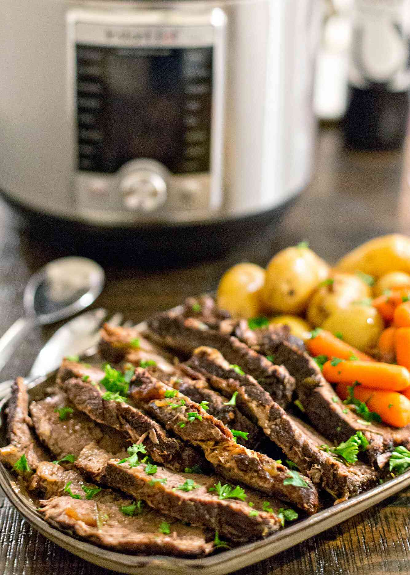 Sliced roast beef, cooked carrots, and cooked potatoes for instant pot pot roast