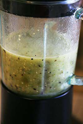 Tomatillos with garlic, jalapeño, cilantro that have been puréed in a blender